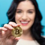 woman-holding-physical-bitcoin-woman-holding-physical-bitcoin-cryptocurrency-her-hand-106247745